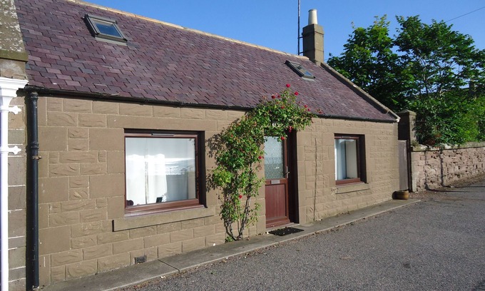 Johnshaven Cottage | Myrtle Cottage set in an elevated location with spectacular sea views.