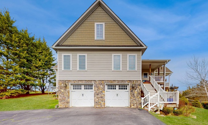 Livingston House | Nature lover’s lakefront home with a beach, dock, fire ring, & more