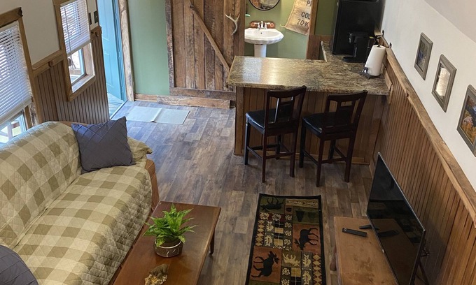 Gray Hawk Cabin | Nestled in woods a stone's throw from Daniel Boone Forest and 600 mi of trails .