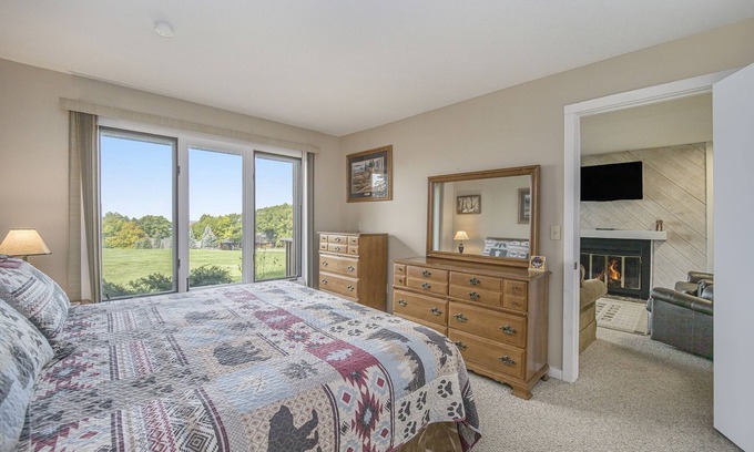 Bellaire Condo | New! Cozy Condo w/Fireplace & Lake Views at Summit Village