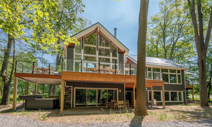 Waterfront Greens House | New! Discover Serendipity: Lake Front, Dogs Ok, Pool, Hot Tub!