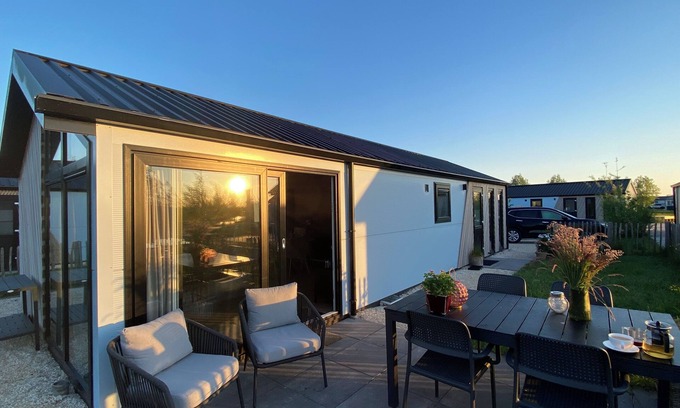 Municipality of Kampen House | NEW Elegant waterfront chalet with jetty Lake Kampen Netherlands vacation home boat
