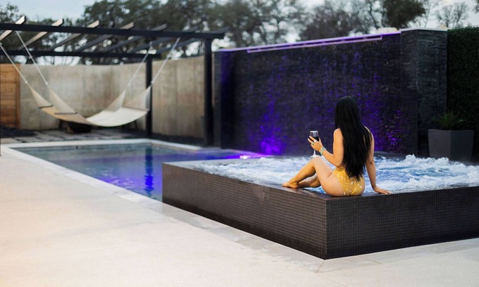 Concan House | NEW Glam Luxury Home by River! Heated Pool Hot Tub Movie Room Firepit Sleeps 24
