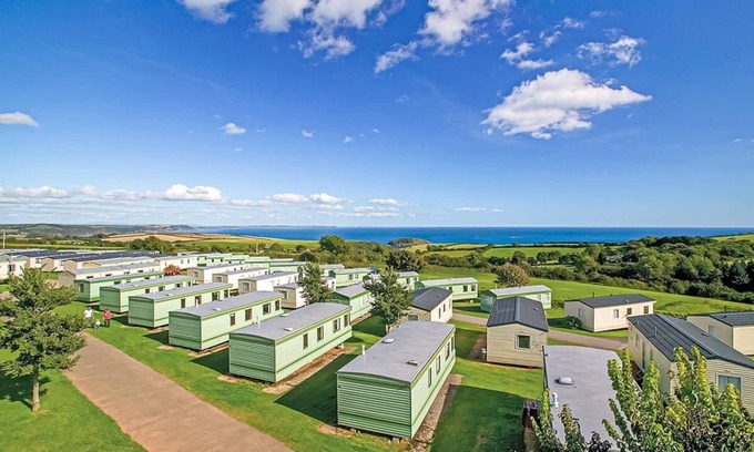 Looe House | New in 2017, 2018 and 2019. 12ft-wide superior caravan with one double and two twin.