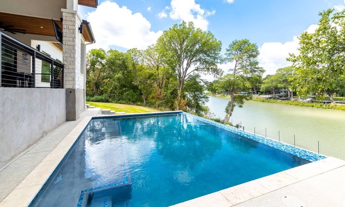 Seguin House | NEW! Lakefront lux - pool, hot tub, game room, pets, sleeps 20! No cleaning fee!