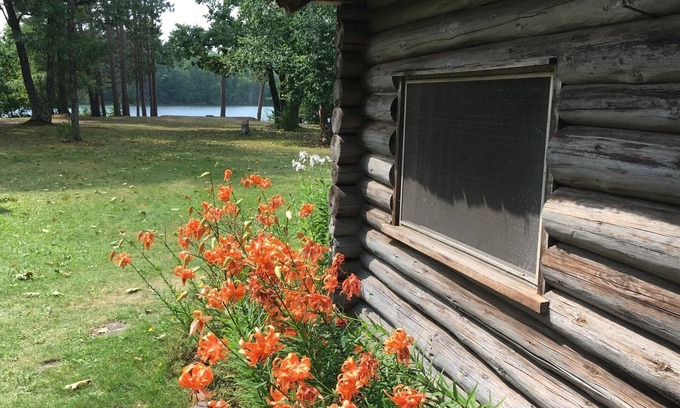 Land O Lakes Cabin | New! Sleeps 15 Level lawn to lake. Sandy beach. Two docks. Great fishing.