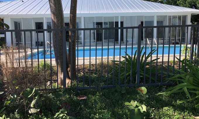 The Dunes House | Newly renovated 2024. Located on golf course with a lake view and pool.