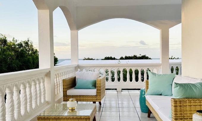West End Village House | Newly Renovated Luxury West End Home Steps to Mead’s Bay and the Four Seasons.