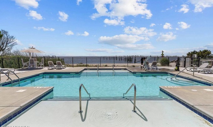Southport Condo | No Cleaning Fee! Brand New Double Queen Studio Condo w/Waterfront Pool + Beach