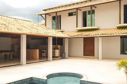 Bom Pastor House | NossoApê Guarua: Piscina | Churrasqueira | Ar-condicionado
