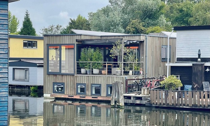 Hoofddorppleinbuurt Boat Rental | Nova Houseboat Deluxe. 180m2 Water villa on the Amsterdam Lake with free bikes