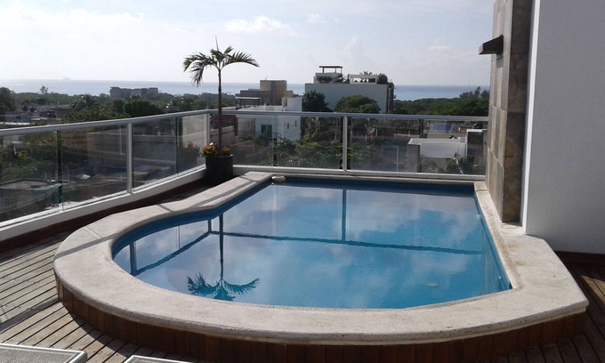 Luis Donaldo Colosio Condo | Ocean view condo with rooftop pool near the beach