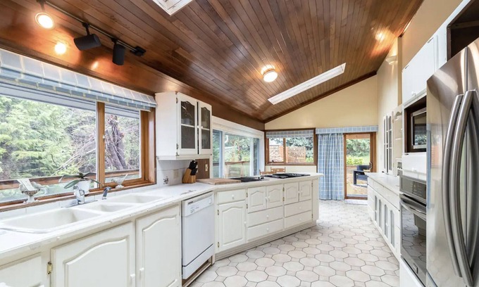 District of North Vancouver House | Oceanfront Cottage w/Rare pvt dock, hot tub, large backyard
