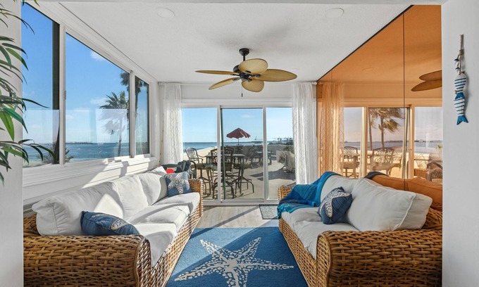 Alamitos Beach House | Oceanfront retreat with rooftop deck, modern interior, marble finishes, & W/D
