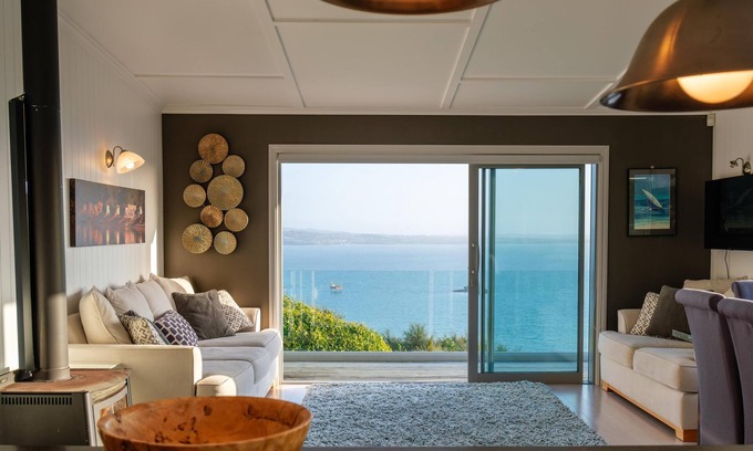 Omiha House | Ōmiha Oasis - Ōmiha Oasis is a premium family holiday home with spectacular views and wonderful amenities set in the tranquil surroundings of Ōmiha (Rocky Bay), Waiheke Island. The property has three bedrooms and two bathrooms, making it perfect for