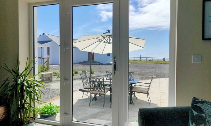 Newry House | On Cranfield beach modern house sea/mountain views