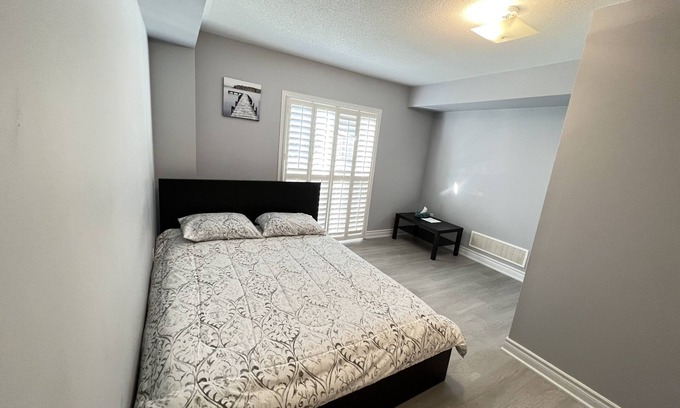 Meadowvale Village House | One bedroom ensuite toilet on main level & kitchen, living, bathroom lower level