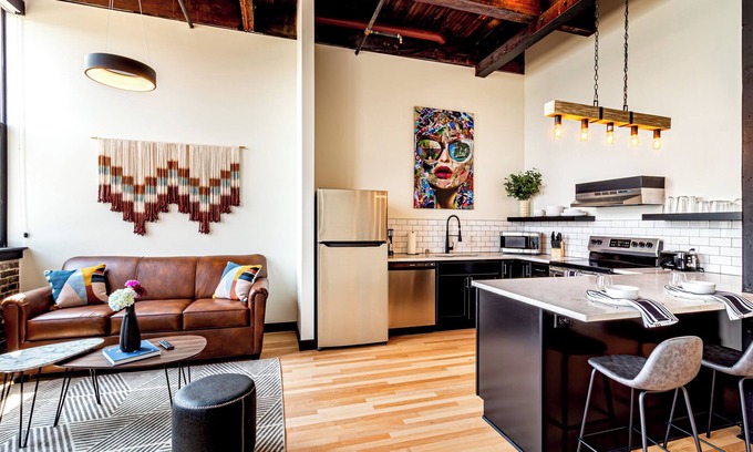 Madison Hotel | One Bedroom King with Den with views of the heart of downtown.