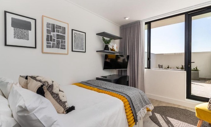 Cape Town City Centre Apartment | One On Albert -Vibrant Woodstock Apartment with Private Patio Area