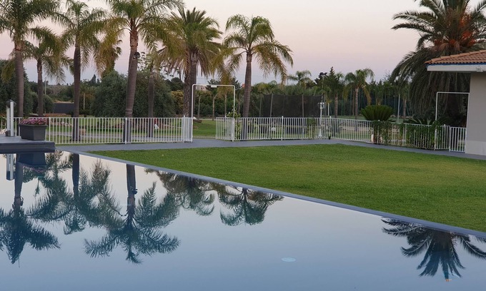 Floridia Villa | Orange house with large park and swimming pool.