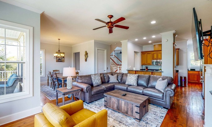 St. Marys House | Palm-lined home with dock access, firepit & inviting balconies