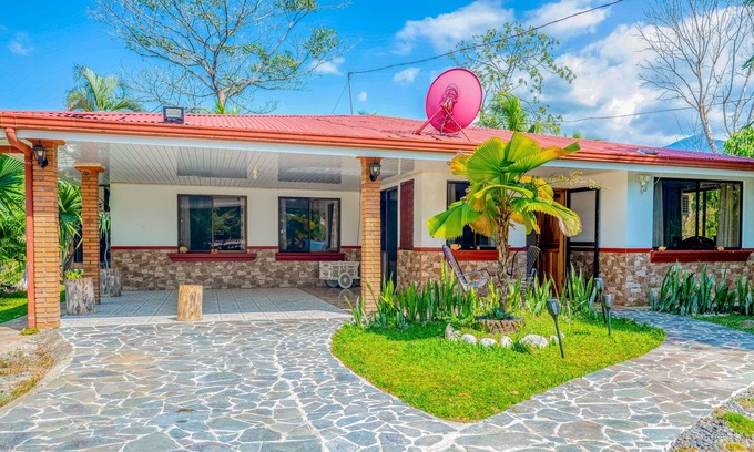 Garabito House | Palm-lined paradise with a pool, wood stove, & mountain views - dog-friendly