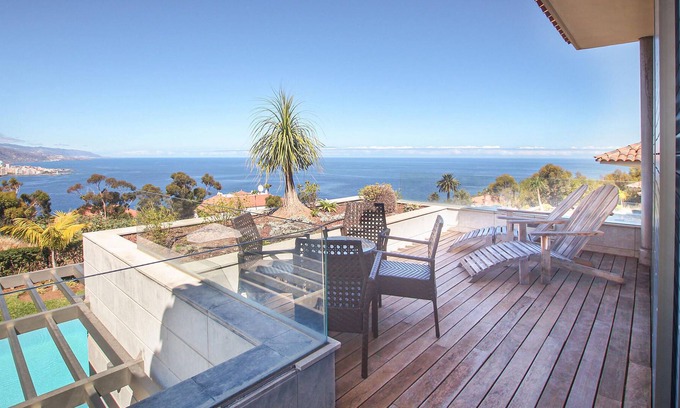 La Quinta House | Palm trees, mountains, sea ? Your view from the balcony and garden of this vacation home in Tenerife