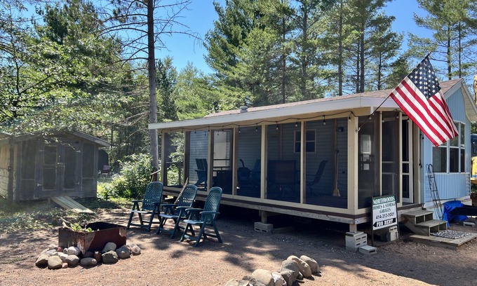 Boulder Junction Cabin | Parkmodel cabin w screened porch in campground on bike trail.