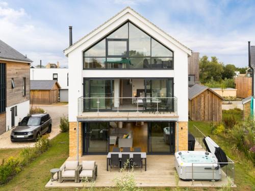 Cirencester House | Pass the Keys Minety Lake lodge hot tub games room