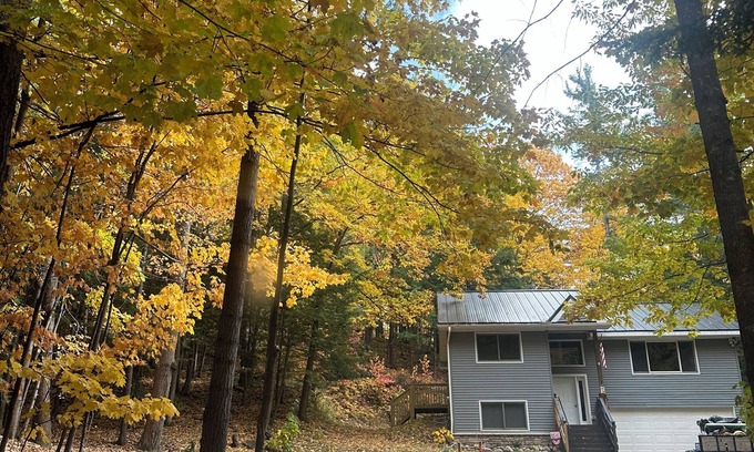 Walloon Lake Cabin | Peaceful cabin hideaway with fire pit & hot tub only 3 blocks from Walloon Lake