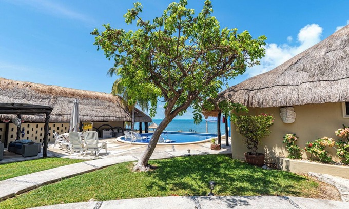 Isla Mujeres House | Peaceful cottage on the beach with heated pool, sunsets and tropical gardens