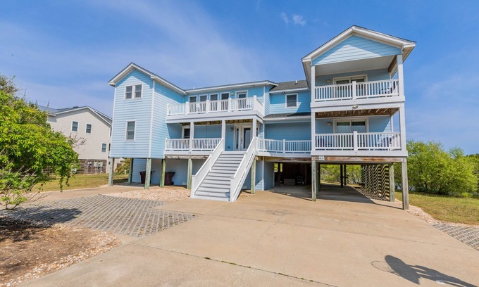 Southern Shores House | Peaceful lakefront views with private saltwater pool, large scale living, and wonderful amenities