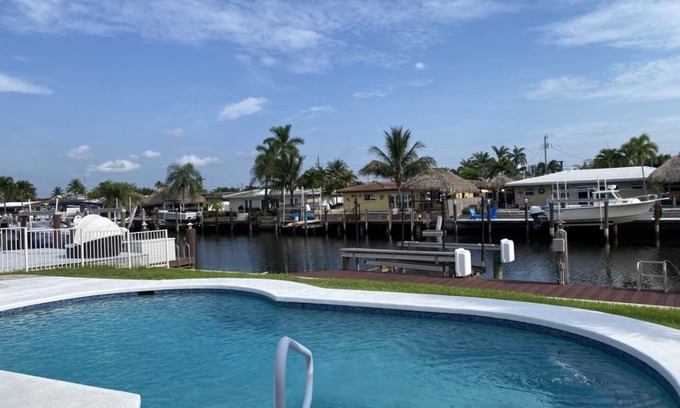 Garden Isles House | Peaceful, Serene Waterfront- Jacuzzi Heated Pool and BBQ Grill