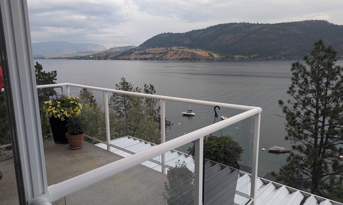 Adventure Bay Condo | Penthouse Condo with amazing OK lake and mountain views, private beach and dock.