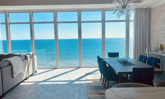 Thomas Drive Condo | Penthouse corner, floor to ceiling windows, high ceilings 2 primary a guestroom