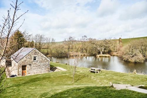 Llanybri House | Penuwch Boathouse- Lakeside rural cottage ideal for families with indoor heated pool