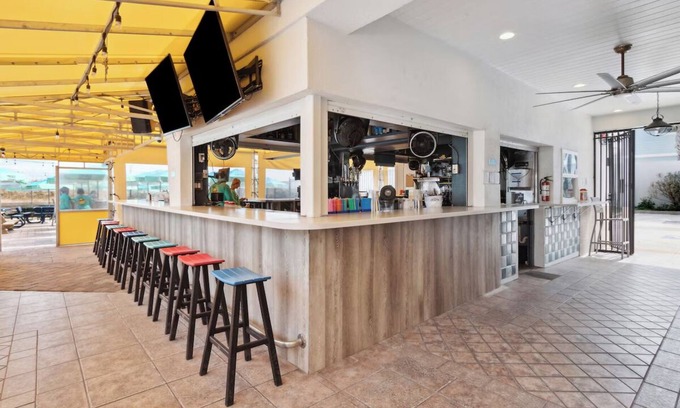 Neptune Beach Hotel | Perfect Beach Getaway: 4 Family Rooms, Outdoor Pool & Pet-Friendly