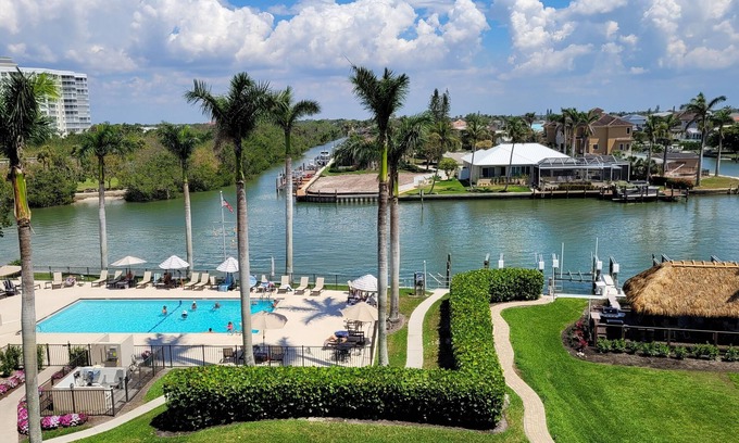 Vanderbilt Beach Condo | Perfect Location! On The Bay Direct View of Gulf! Wrap Around Lanai!