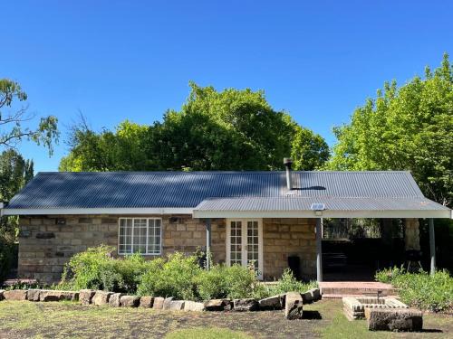 Clarens House | Periwinkle, Grove ,Acorn & Sage Cottages