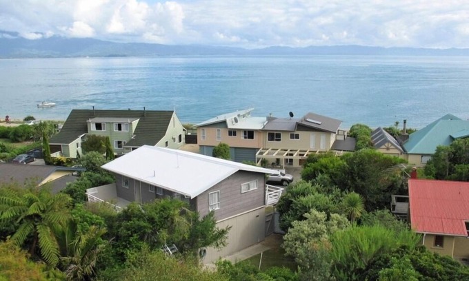 Tata Beach House | Pet friendly yard, great Sea Views and just across the road from Tata Beach
