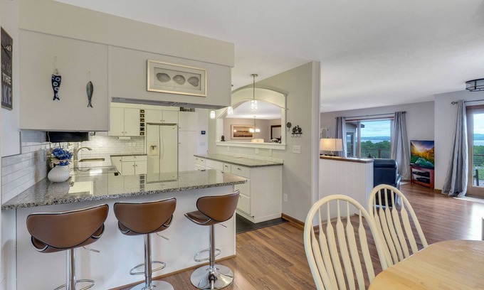 Petoskey House | Petoskey Home with Little Traverse Bay Views | Sleeps 8 | Wrap Around Deck