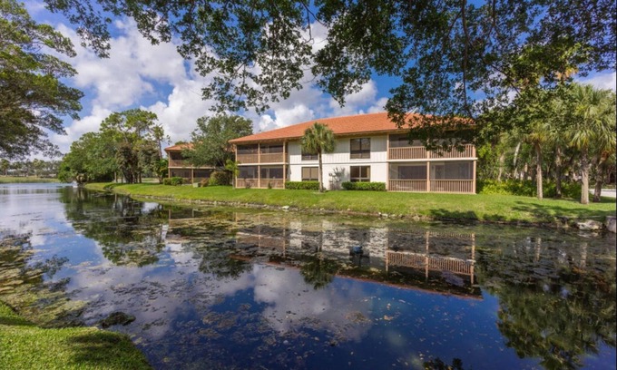 Hunt Club Condo | PGA National Resort Golf Villa - Luxurious Two Bedroom First Floor Water View