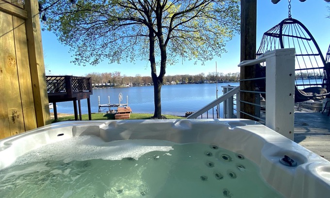Plainwell House | Pine Lake Retreat- sparkling hot tub! Lakeside house with sandy beach lakefront!