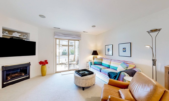 Lewes House | Plantations East dog-friendly townhouse with fireplace & water view