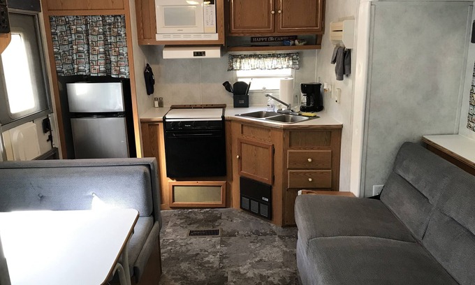 Benzonia House | Platte - RV Camper in the Woods with Fire pit & Hot Tub Access