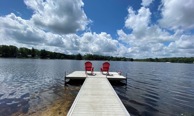 Penn Lake Park House | Pocono Lakefront Home- with Private Dock & Swim Raft, Fire Pit, & Boats!