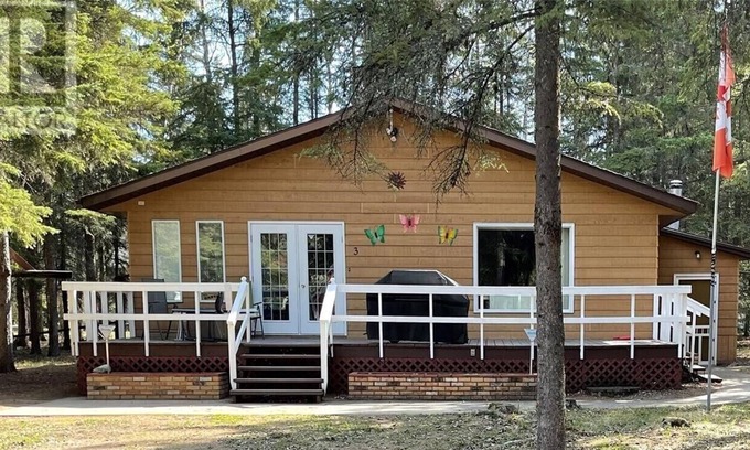 Candle Lake House | Privacy Galore! Enjoy this roomy year round lake home surrounded by the forest