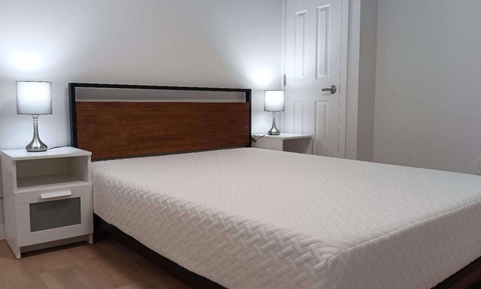 Northwest Calgary House | Private bathroom, living room with projector - Basement Suite for 3
