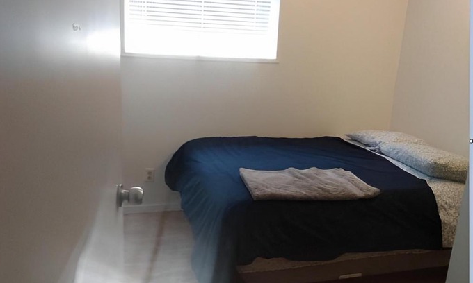 Calgary House | Private bedroom in basement suite - Pineland