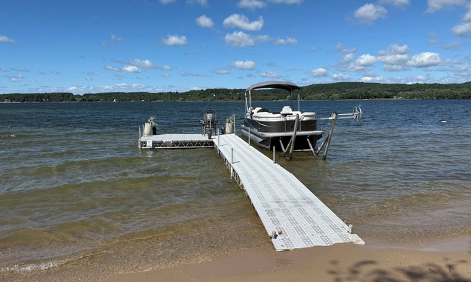 East Jordan House | Private DOCK & BEACH on Lake Charlevoix/Boat Rental/Golf-Cart/RV Parking